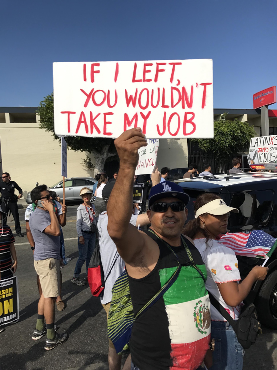 Young man in LA Dodgers hat, sign: If I left, you wouldn’t take my job